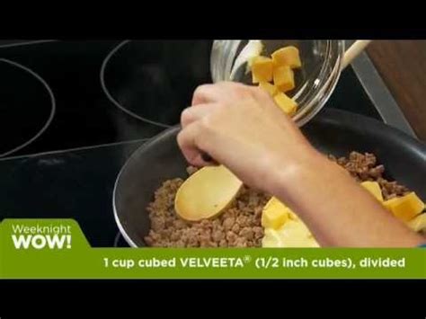 Stir in 1/2 cup of the enchilada sauce and the chiles. VELVEETA and RO*TEL Beef Enchilada Bake - YouTube