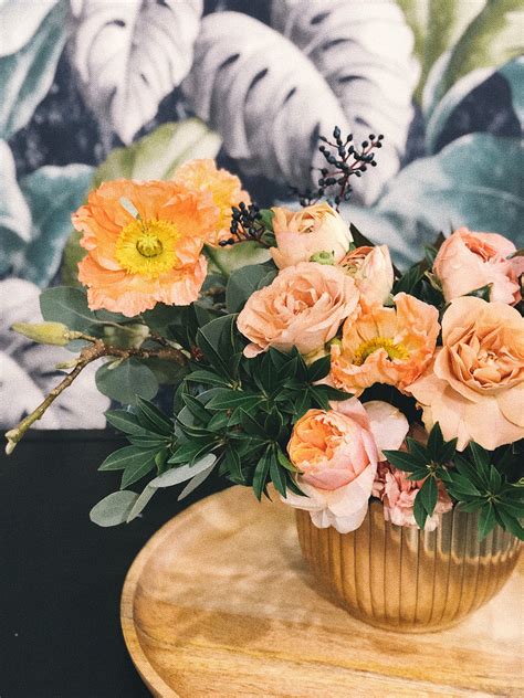Vase with pink flowers on a gray background. Peach Peony Flowers and Pink Poppy Flowers in Vase on ...