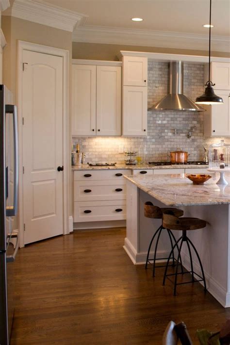 The simple construction, also referred to as rail and style. White Kitchen Cabinets With Black Hardware | Countertopsnews