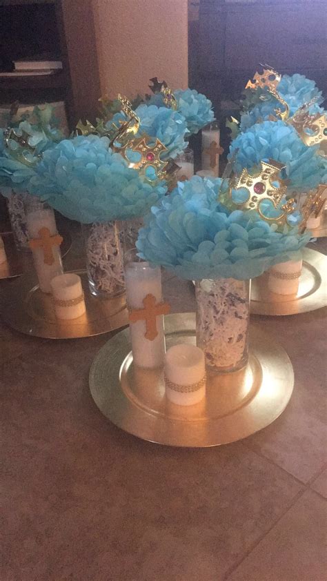 These adorable centerpieces features a beautiful cross. These baptism centerpieces are adorable and look very easy to make. | Boy baptism centerpieces