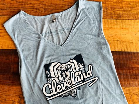 Helmets seen on the statues were incorporated into the guardians fastball logo. Cleveland Guardian Denim V-neck Tank (W) - Market Garden ...
