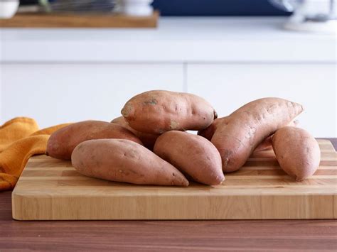 Use a fork to poke holes into the sweet potatoes, and set them on the baking sheet. How to Bake Sweet Potatoes : Food Network | Thanksgiving ...