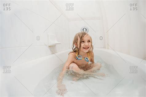 It'll make those precious moments easier and better! taking bath stock photos - OFFSET
