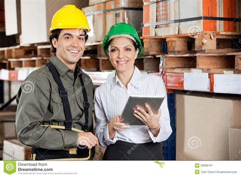 Supervisor Instructing Foreman At Warehouse Stock Image - Image of ...