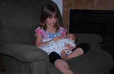 big sisters baby holding