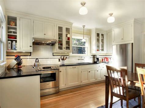 The recessed panel doors in this craftsman style kitchen look fantastic, and really do a great job of supplying the cabinets with some added depth. I like the trim, inset cabinet doors, the faucet mounted on the wall is awesome. This is from a ...