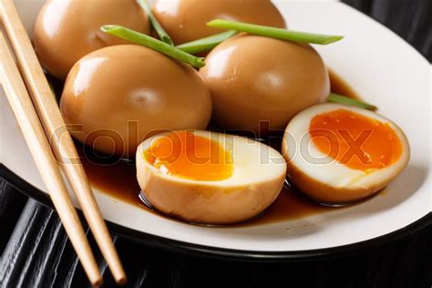 1/3 cup mirin or 1/3 cup rice vinegar & 1.5 1. Nitamago is a boiled egg in savory ... | Stock image ...