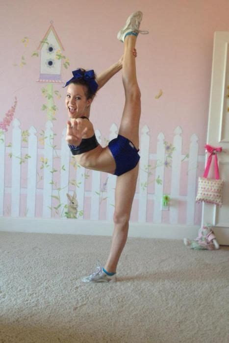 The gymnastic, stretch, fitness, lifestyle, training, sport concept. Regan West CHEER scorpion / needle - cheerleader p.3.5 # ...