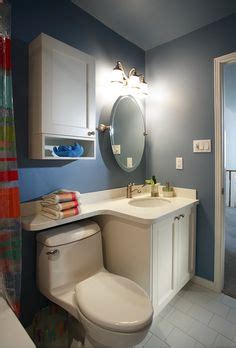 Bathroom vanity extending over toilet home sweet home. Molded vanity sink with hinged shelf over toilet - Google ...