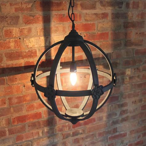 Brown wood and iron 4 light valencia chandelier. large round metal iron orb chandelier by cowshed interiors ...