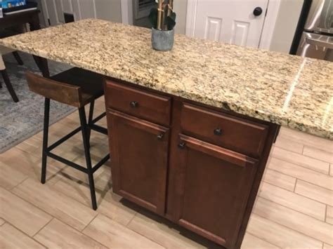 Bracket designed to provide evenly distributed support throughout the granite countertop using a cantilevered system. Hidden Island Support Bracket - The Original Granite Bracket