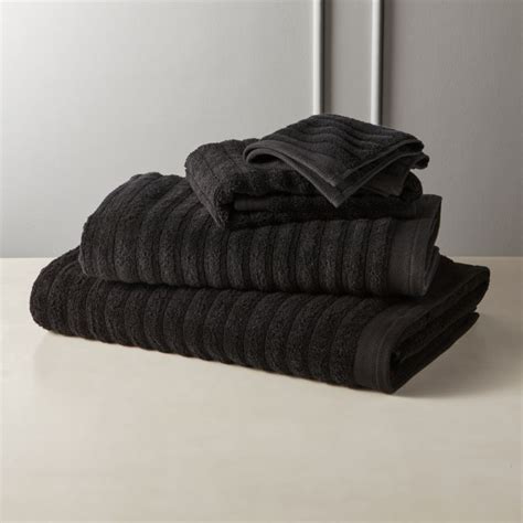 The extra large luxury bath towel by utopia towels is perfect for people who prioritize surface space and coverage in their towels. Channel Black Bath Towels | CB2