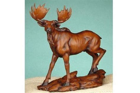 The sculpture towers 32 feet (10 meters) above the ground, and stretches 39 feet (12 meters). moose statues or figurines | ... Wood Walking Moose ...