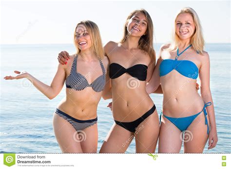 Ever wanted to play with your friends, or you don't have friends but wanted the game to be more challenging? Three Young Women In Bikini On Beach Stock Image - Image ...