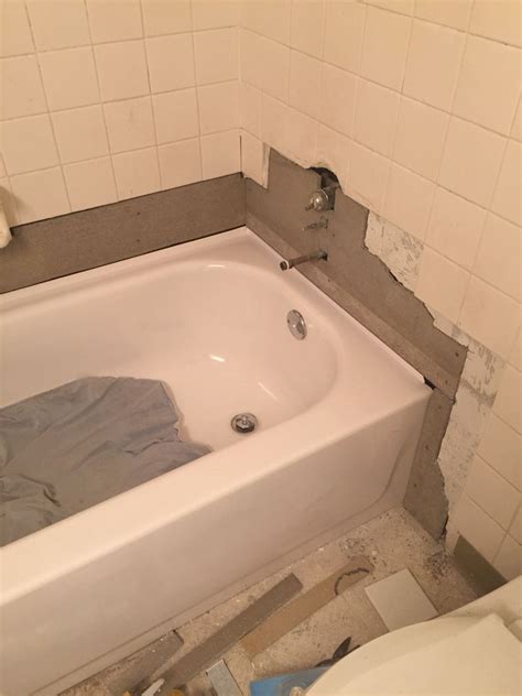 We removed a wall where an old single vanity used to be in favor of a double vanity. Plumbing fixed....new tub inserted, adding durarock to ...