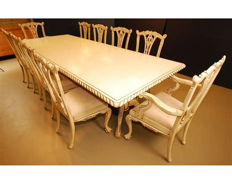 Custom built and individually hand carved out of solid mahogany Chippendale 10 Seat Dining room set