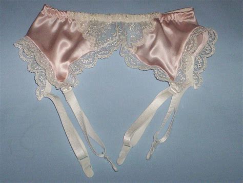 Maybe you would like to learn more about one of these? Blush pink silk satin and lace garter belt
