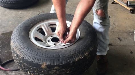 This will pop the tyre off the rim, then you can use tyre levers to lift the tyre completely off the rim ! How to Mount and Dismount a Tire from the Rim - YouTube