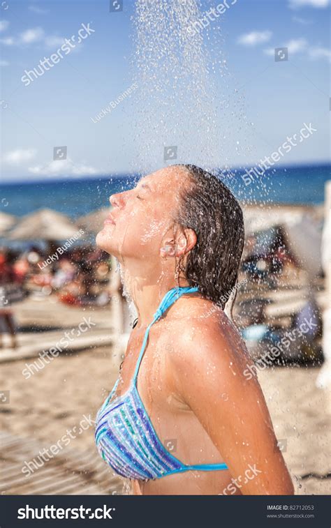 Showering moms and teens on hidden camera. Woman Under Shower On The Beach Stock Photo 82712053 ...