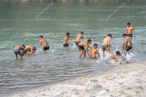 Tm + © 2021 vimeo, inc. Indian boys swimming in the sacred water of the river ...