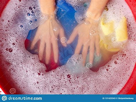 The dies used to color clothing can actually wash out just a little bit. Women Washing Color Clothes In Basin Enemale Powdered ...