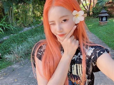 He clutches his mic in his left hand. MOMOLAND's JooE Can Pull Off 10+ Crazy Hair Colors And ...