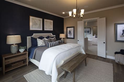 Ideas for spicing up the bedroom. A Navy blue accent wall in the bedroom creates a look of ...