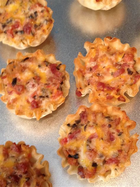 I promise it's as simple as dumping into a pan and allowing it to. Rotel Bites: Fillo cups filled with Rotel, cheese, bacon ...