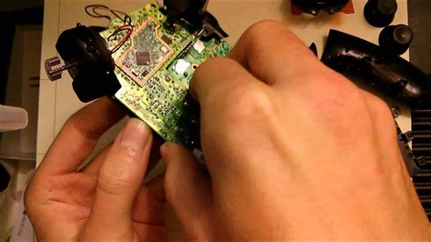 Lay down something soft (so you don't scratch the jewel), and flip the xbox upside down on your soft surface. How to take apart the Xbox One Controller - YouTube