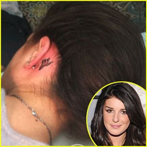 The tattoo involves the word 'тихо' which can be translated. Shenae Grimes Tattoos - Celebrities Tattooed