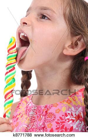 Check spelling or type a new query. Girl with lollipop Stock Photo | k8771788 | Fotosearch