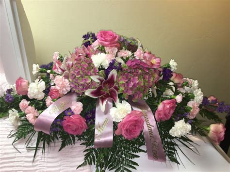 A mother and daughter decide to send grandma flowers using intentcasting technology. Casket piece funeral flowers