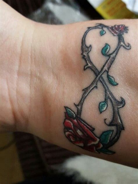 Infinity symbol with red roses by blackmoon9 infinity symbol with red roses and black stalks on a white background. Infinity rose tattoo (With images) | Rose tattoo, Tattoos ...