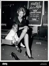 Dec. 12, 1960 - Popular TV pitch-gal Julia Meade and her cuddlesome ...
