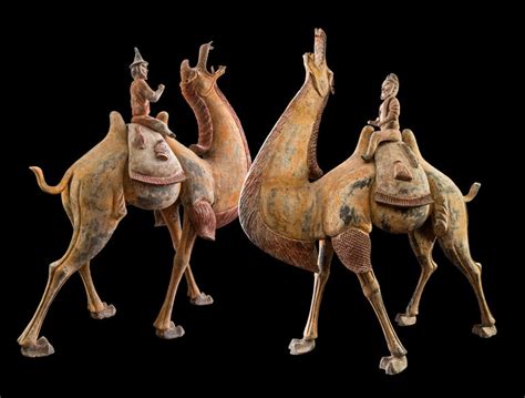 Both camel and groom are elegantly glazed in brown hues that complement the natural coat of the camel. A Pair of Tang Dynasty Chinese Terracotta Bactrian Camels ...