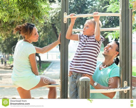 Lyndee had fallen unconscious for 12 days. Family Of Three Together Training On Pull-up Bar Stock Image - Image of sports, outdoor: 71847355