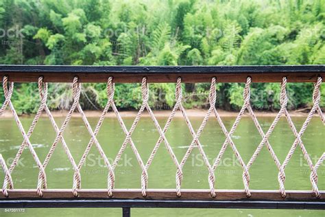 End ropes for hand rail nets: Rope Banister With River Background Stock Photo - Download ...