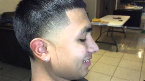 The hair is cut high and tight on the sides and back (zero length up to the crown). Taper fade with 8 - YouTube