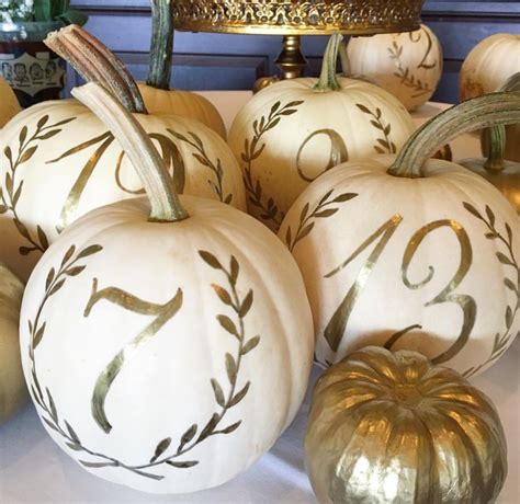 Decorating pumpkins doesn't have to be all about carving. White pumpkin Table Numbers for a Fall wedding | Pumpkin ...