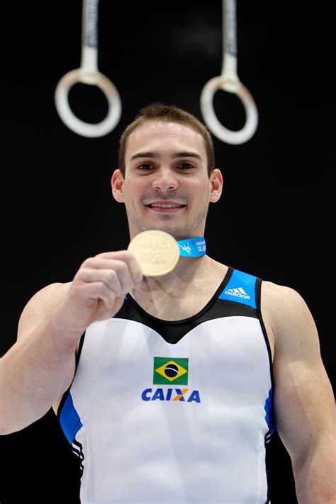 Arthur nabarrete zanetti of brazil celebrates on the podium after winning the rings competition during day two of the gymnastics world challenge cup. Arthur Zanetti | Ginasta Olímpico