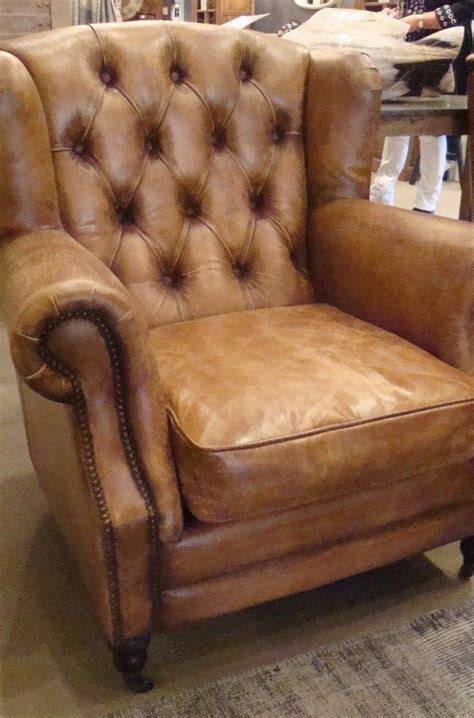 Lush leather upholsters the piece,. Small Armchairs For Living Room #ComfyOverstuffedChairs ...