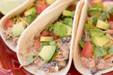 Crockpot chicken nachos are loaded with shredded chicken, beans, corn, and cream cheese to make them creamy! Easy Crockpot Creamy Chicken Tacos - The American Patriette