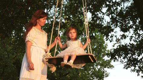 Natalia forrest playing with ropes. Dad And Mom Teach Daughter To Ride A Bike. Mother And ...