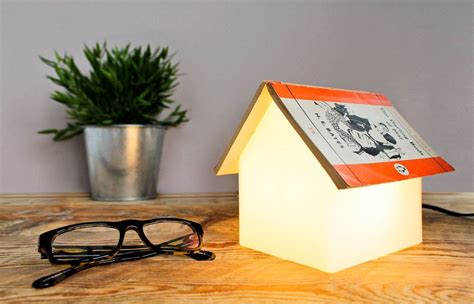 Designed as a simple, geometric house shape, this glowing book rest lamp makes a brilliant lightsource for your reading nook or night stand. Just add your favorite book. | Book rest, Book lamp, Book ...