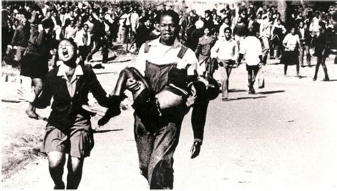 .regime, showing hector pieterson carried by a fellow schoolboy after police gunned him down in soweto in 1976. Mbuyisa Makhubu, just 18 years old during the Soweto ...