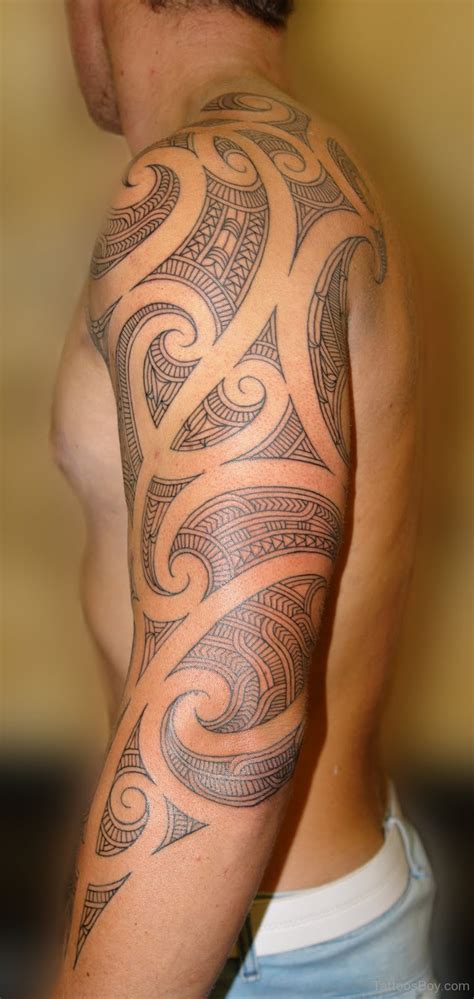 Tribal shoulder tattoos look great with their meandering curves and pointed angles. 69 Traditional Tribal Shoulder Tattoos