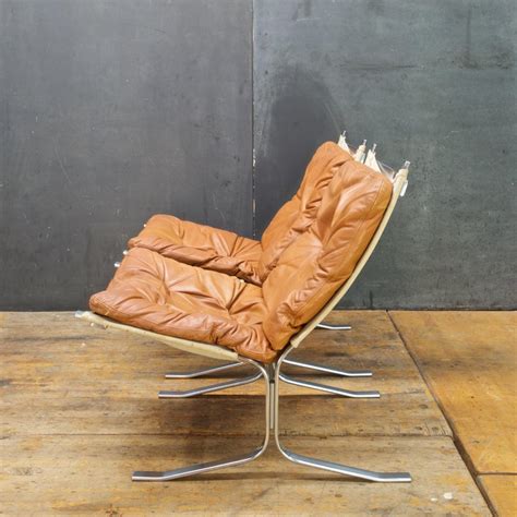 It is characterized by a simple and refined synthesis with nature, and the style impacted everything from architecture to furniture. 1960s Mid-Century Steel Leather Canvas Sling Lounge Chairs Vintage Mid-Century For Sale at 1stdibs