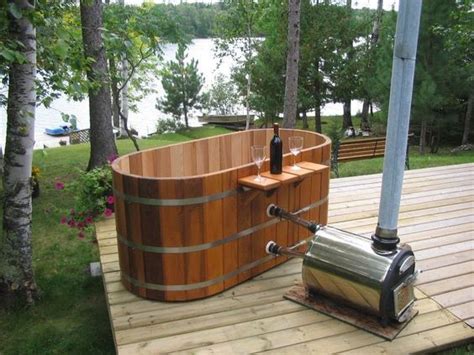 A small shelf provides access to a. CampFire | Portable hot tub, Cedar hot tub, Outdoor tub