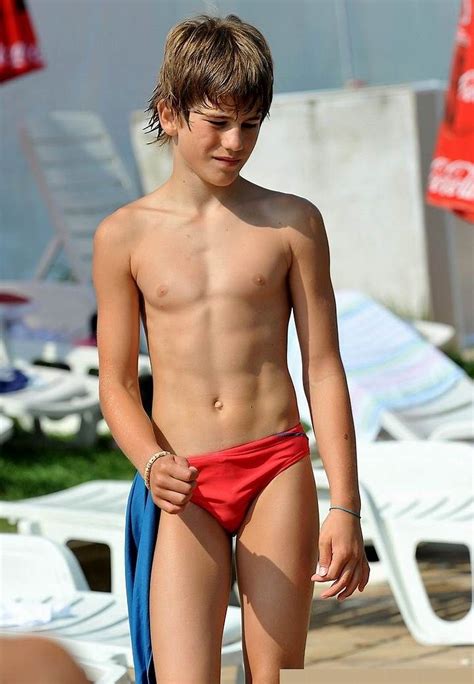 Young boy standing shirtless in shower and laughing holding japanese red umbrella and his hand to his head. Pin on Photography