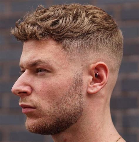 It's a very short crop with a hard part on one side and a. Curly Blonde Taper Fade | Men's curly hairstyles, Short ...